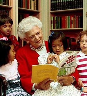 Barbara Bush reading to young kids